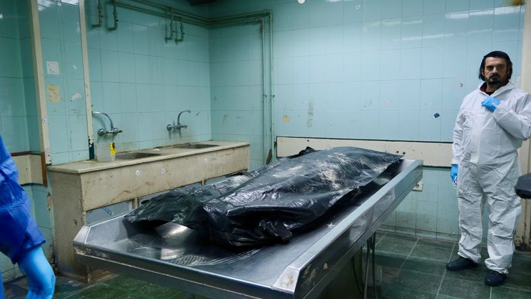 A body bag in an examination room of a hospital morgue in Damascus, Syria.