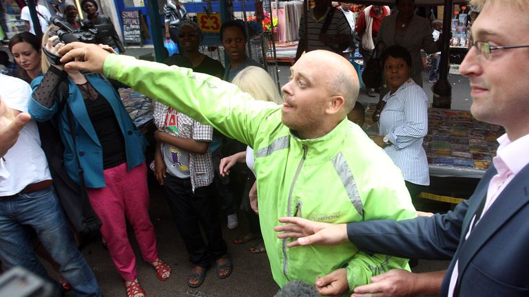 A man, who has given his name as Dean Porter, throws eggs at Labour leader Ed Miliband during a campaign visit in East Street market in Walworth, south London.
Pic: PA