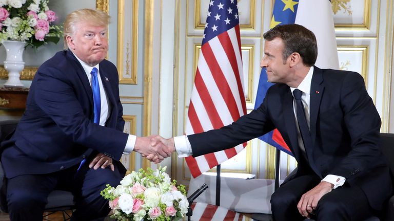 Donald Trump and French President Emmanuel Macron shake hands during a meeting at the Prefecture of Caen, on the sidelines of D-Day commemorations marking the 75th anniversary of the World War II Allied landings in Normandy, France. Ludovic Marin/Pool via REUTERS