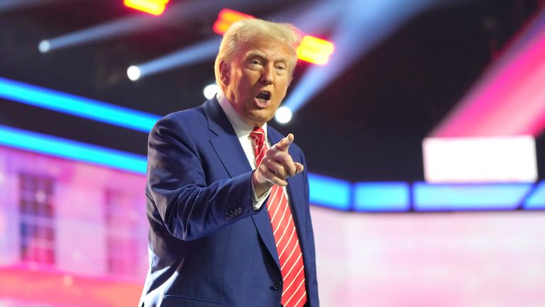 President-elect Donald Trump speaks at AmericaFest, Sunday, Dec. 22, 2024, in Phoenix. (AP Photo/Rick Scuteri)