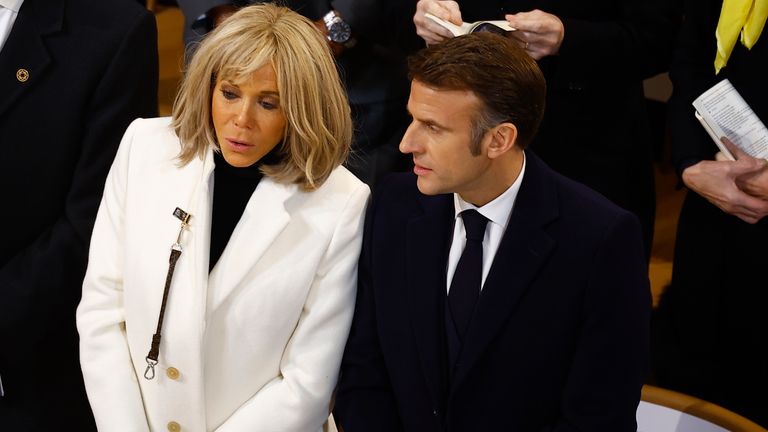 French President Emmanuel Macron and his wife Brigitte Macron attend the inaugural Mass to mark the Cathedral's reopening after its restoration, in Paris, France, Sunday, Dec. 8, 2024. (Sarah Meyssonnier/Pool Photo via AP)