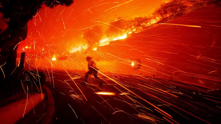 Firefighters battle the Franklin Fire in Malibu, California.
Pic: AP