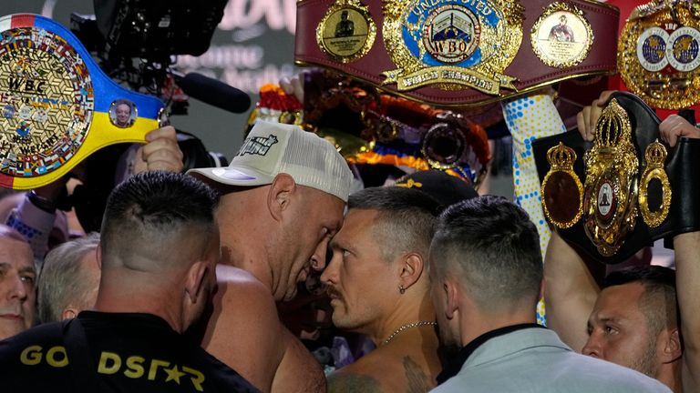 Heavyweight boxers Britain's Tyson Fury, center left, and Ukraine's Oleksandr Usyk face off during the weigh-in in Riyadh, Saudi Arabia, Friday, May 17, 2024, prior to their undisputed heavyweight championship fight on Saturday. (AP Photo/Francisco Seco)