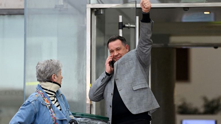 David, one of the two sons of  Gisele Pelicot gives a thumbs up as he makes a phone call outside the courthouse.
Pic: Reuters