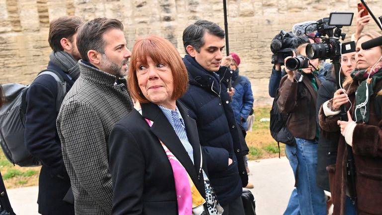 Frenchwoman Gisele Pelicot, the victim of an alleged mass rape orchestrated by her then-husband Dominique Pelicot at their home in the southern French town of Mazan, arrives with her lawyers Stephane Babonneau and Antoine Camus to attend the verdict in the trial for Dominique Pelicot and 50 co-accused, at the courthouse in Avignon, France, December 19, 2024. REUTERS/Alexandre Dimou