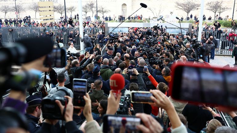 Frenchwoman Gisele Pelicot, the victim of an alleged mass rape orchestrated by her then-husband Dominique Pelicot at their home in the southern French town of Mazan, leaves the courthouse surrounded by French police and journalists after the verdict in the trial for Dominique Pelicot and 50 co-accused, in Avignon, France, December 19, 2024. REUTERS/Manon Cruz