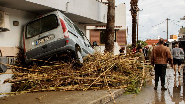 People assess the damage caused by Storm Bora on Rhodes. Pic: Reuters