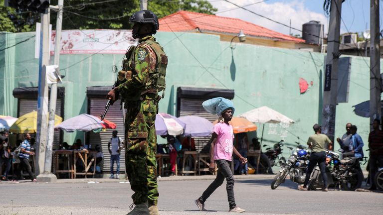 FILE PHOTO: A Kenyan police officer patrols as the country is facing emergency food insecurity while immersed in a social and political crisis, in Port-au-Prince, Haiti October 3, 2024. REUTERS/Jean Feguens Regala//File Photo