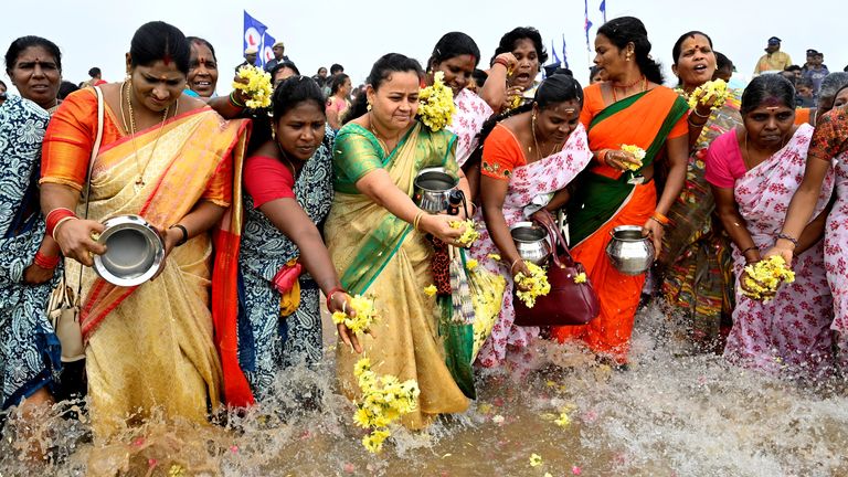 People scatter flower petals after pouring milk into the Bay of Bengal as a gesture of respect to the victims of the 2004 Indian Ocean Tsunami on the 20th anniversary of the disaster, at Marina Beach in Chennai, India.
Pic: Reuters