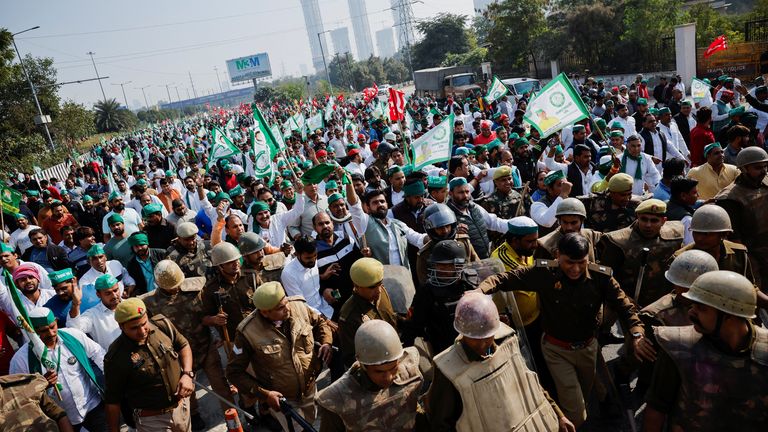 Farmers from the northern state of Uttar Pradesh shout slogans as they protest to demand better compensation for their land, in Noida, India, December 2, 2024. REUTERS/Anushree Fadnavis