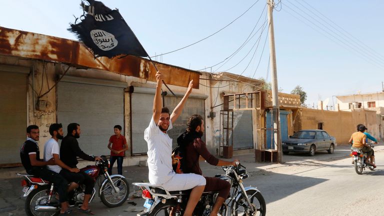 Celebrations after Islamic State took over air base near Raqqa in 2014. Pic: Reuters