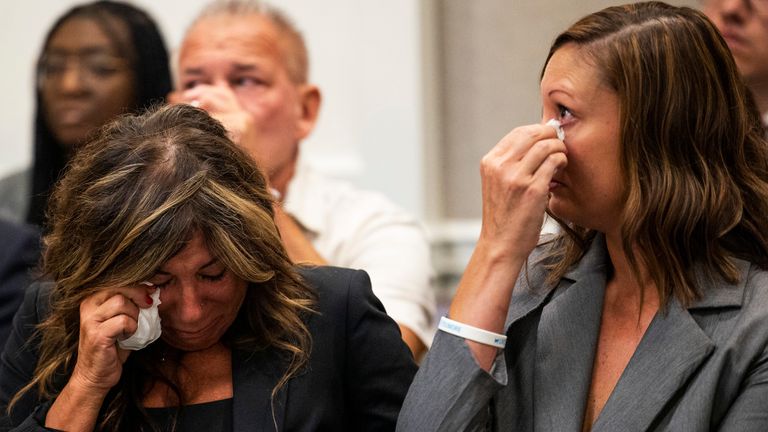 FILE - Lisa Miller, left, and her daughter, Mandi Jenkins, hitch   tears from their eyes aft  testifying during a enslaved  proceeding  for Jamie Lee Komoroski, Aug 1, 2023, astatine  the Charleston County Courthouse successful  Charleston, S.C. (Gavin McIntyre/The Post And Courier via AP, File)