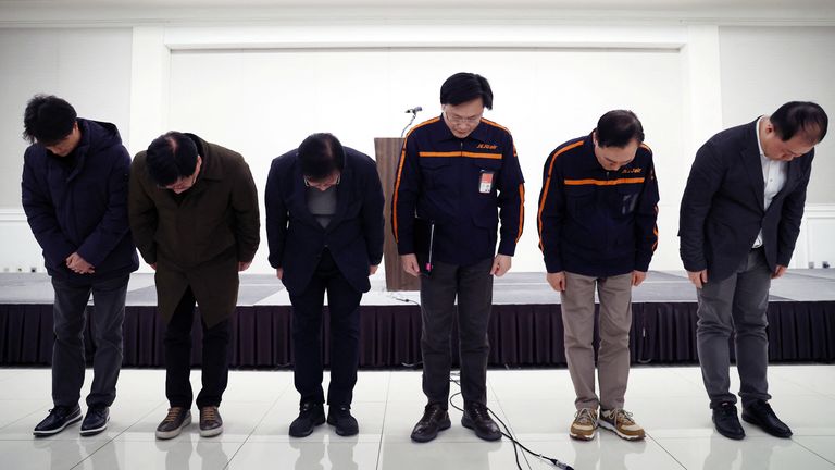 Jeju Air chief executive Kim E-bae and officials bow to apologise for their plane's incident as they hold a press conference. Pic: Reuters