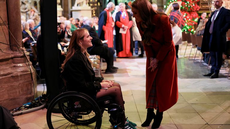 Kate with an attendee of the Together At Christmas event. Pic: Reuters