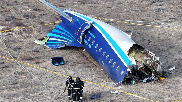 Specialists working at the crash site of the Azerbaijan Airlines plane near Aktau, Kazakhstan. Pic: Reuters