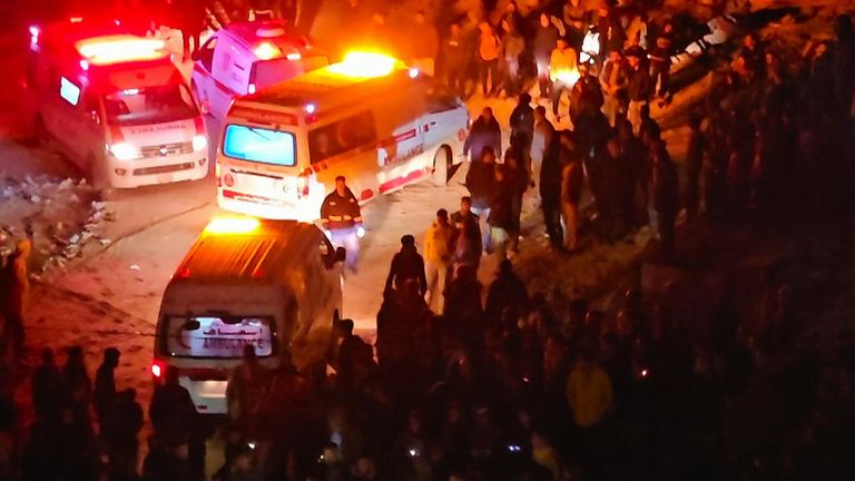 Ambulances at the scene of a strike that hit a school in Khan Younis