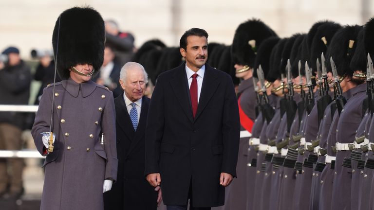 King Charles III (centre) and the Emir of Qatar Sheikh Tamim bin Hamad Al Thani (right) during the ceremonial welcome for the Emir of Qatar and his wife Sheikha Jawaher at Horse Guards Parade, London during the state visit to the UK of the Emir of Qatar and the first of his three wives. Picture date: Tuesday December 3, 2024.