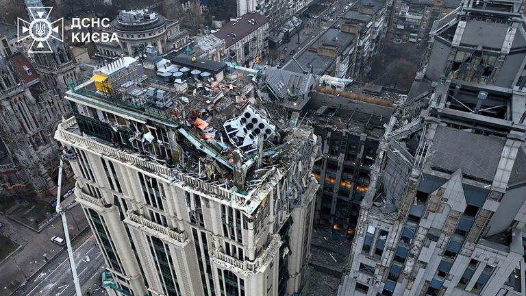 In this photo provided by the Ukrainian Emergency Service, firefighters work on the site of a damaged building after a Russian missile attack in Kyiv, Ukraine, Friday, Dec. 20, 2024. (Ukrainian Emergency Service via AP)