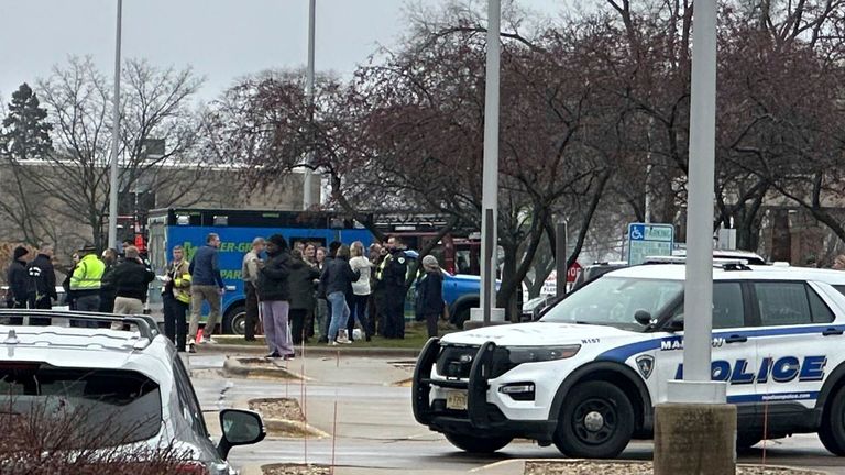 Parents reunite with their children after the shooting. Pic: AP