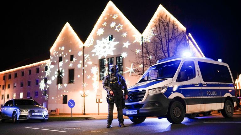 A police officer guards a blocked road near the Christmas market in Magdeburg. Pic: AP