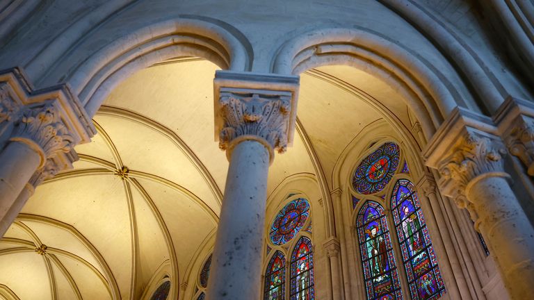 A view of stained glass windows during an inaugural Mass, with the consecration of the high altar, at the Notre-Dame de Paris Cathedral, five-and-a-half years after a fire ravaged the Gothic masterpiece, as part of ceremonies to mark the Cathedral's reopening after its restoration, in Paris, France, Sunday, Dec. 8, 2024. (Sarah Meyssonnier/Pool Photo via AP)