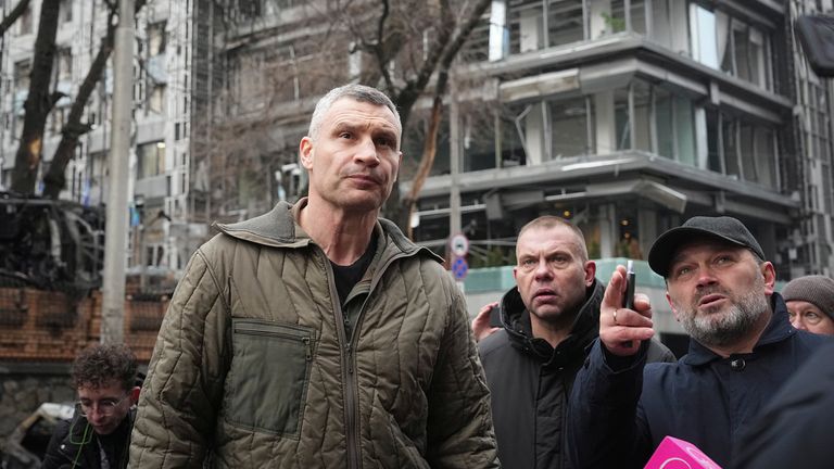 Mayor of Kyiv Vitali Klitschko inspects the damage near a residential building hit by a Russian rocket attack, in Kyiv, Ukraine, Friday, Dec. 20, 2024. (AP Photo/Efrem Lukatsky)