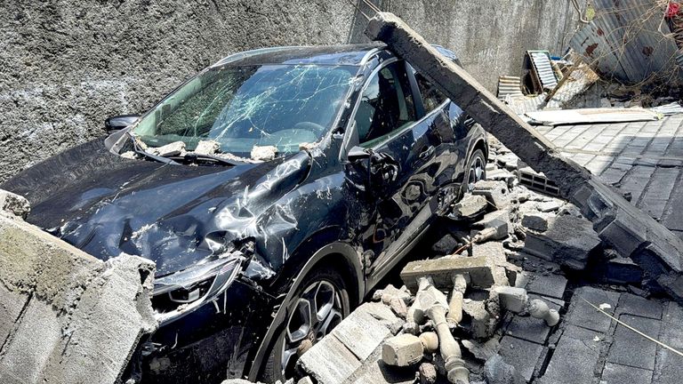 The wreckage of a car lies outside a home, in the aftermath of Cyclone Chido, within Labattoir, in Mayotte.
Pic: Reuters