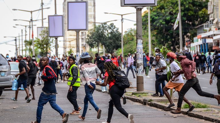 Protesters disperse as police deploy in Maputo, Mozambique, Thursday, Nov. 7, 2024. Protesters dispute the outcome of the Oct. 9 elections, which saw the ruling Frelimo party extend its 49-year rule. (AP Photo/Carlos Uqueio, File)