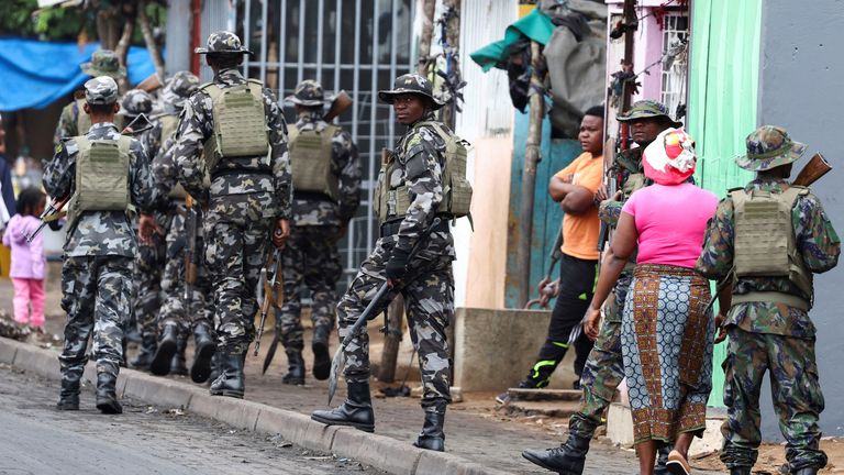 A member of the Mozambique military, looks on as they patrol the streets of the capital a day after a "national shutdown" against the election outcome, in Maputo, Mozambique, November 8, 2024. REUTERS/Siphiwe Sibeko/File Photo