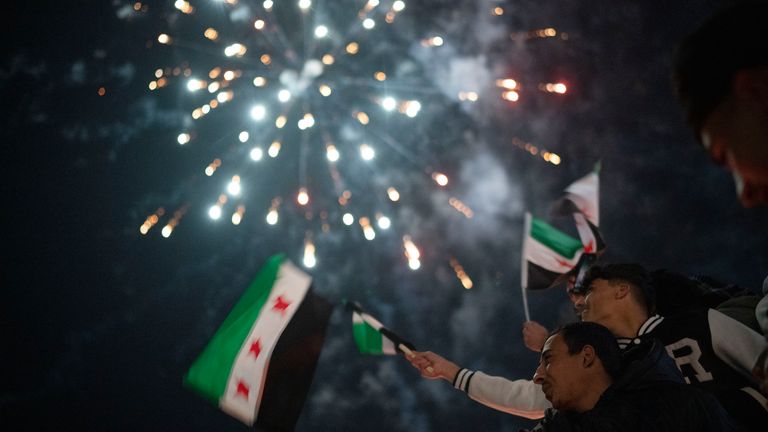 People celebrate New Year's Eve at Umayyad Square in Damascus. Pic: AP