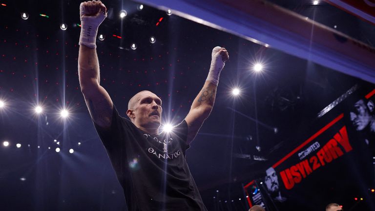 Oleksandr Usyk celebrates winning his bout. Pic: Action Images via Reuters/Andrew Couldridge