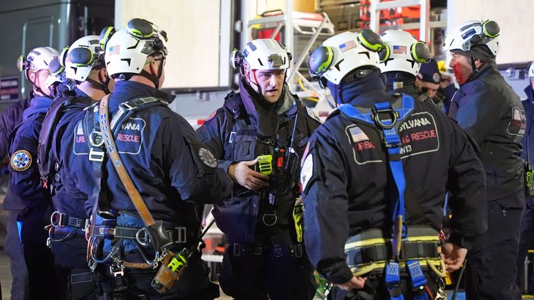 Members of the Pennsylvania Urban Search and Rescue Task Force arrive to help in the search in a sinkhole for Elizabeth Pollard, who disappeared while looking for her cat, in Marguerite, Pa., Tuesday, Dec. 3, 2024. (AP Photo/Gene J. Puskar)