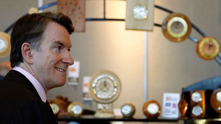 Britain's Business Secretary, Peter Mandelson, stands next to a stall selling clocks at the federation of small businesses conference in Aberdeen, Scotland March 19, 2010. REUTERS/David Moir (BRITAIN - Tags: POLITICS BUSINESS)