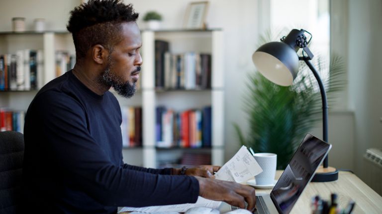 Man calculating budget and finances. Pic: iStock