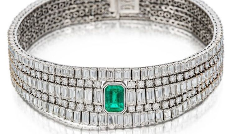 This Boucheron emerald and diamond necklace was among the items taken. Pic: Met Police