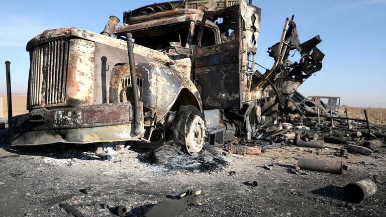 A burnt-out truck near Qamishli International Airport.
Pic: Reuters