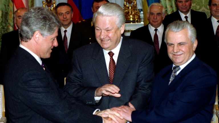 Bill Clinton, former Russian president Boris Yeltsin and former Ukrainian president Leonid Kravchuk shake hands after signing documents on January 14 1994. Pic: Reuters