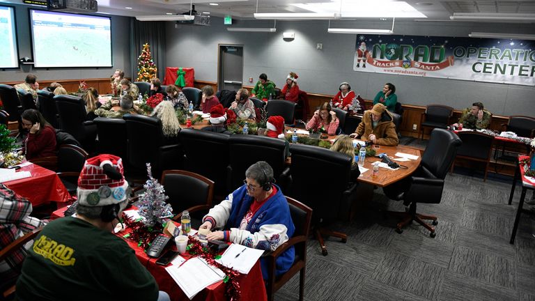 Nearly 1,000 volunteers cycled through the NORAD Tracks Santa Operations Center on Peterson Space Force Base, Colorado, between 4 a.m. and 10 p.m. Dec. 24, 2022. Volunteers providing updated information on Santa's location and gifts delivered worked in two-hour shifts answering phone calls from children and adults located around the globe. Pic: Department of Defense/Chuck Marsh