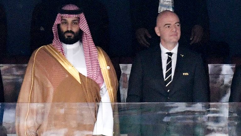 FILE - Saudi Arabia Crown Prince Mohammed bin Salman, left, and FIFA President Gianni Infantino, stand for the anthem prior to the match between Russia and Saudi Arabia which opened the 2018 soccer World Cup at the Luzhniki stadium in Moscow, Russia, on June 14, 2018. (Alexei Nikolsky, Sputnik, Kremlin Pool Photo via AP, File)