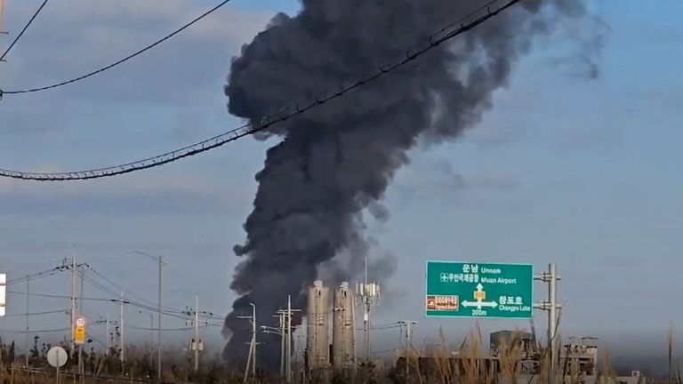 Thick smoke above the airport after the crash.
Pic: Reuters