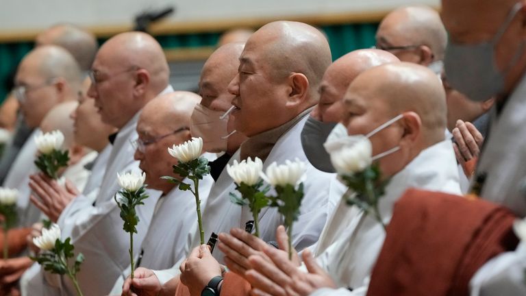 Buddhists monks pray for the victims. (AP Photo/Ahn Young-joon)