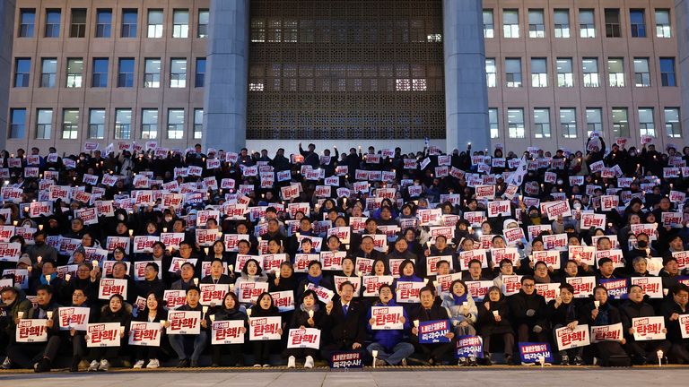 Members of South Korea's main opposition Democratic Party stage a rally against the President Yoon Suk Yeol at the National Assembly in Seoul, South Korea.
Pic: Yonhap/AP