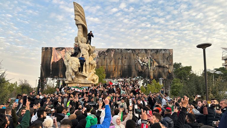 People gather at Saadallah al Jabiri Square in Aleppo to celebrate. Pic: Reuters