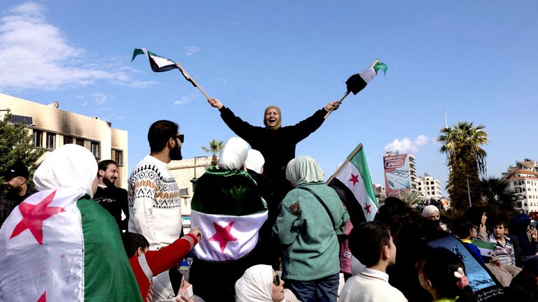 People celebrate after ousting of Syria's Bashar al-Assad, during a gathering after Friday prayers in Latakia, Syria.
Pic: Reuters