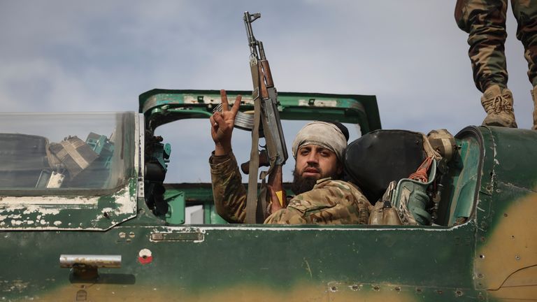 A Syrian rebel at the Hama military airport. Pic: AP