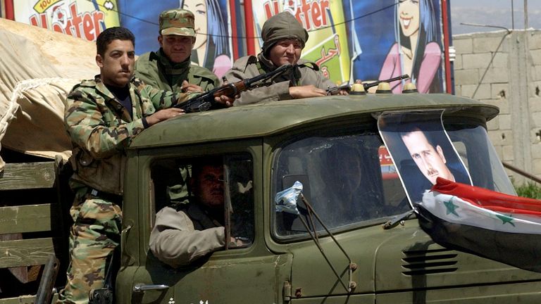 Syria soldiers pulling out of Lebanon in 2005. Pic: AP