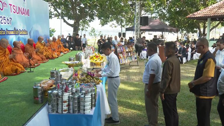 People gather to commemorate victims of tsunami in Thailand on 20th anniversary