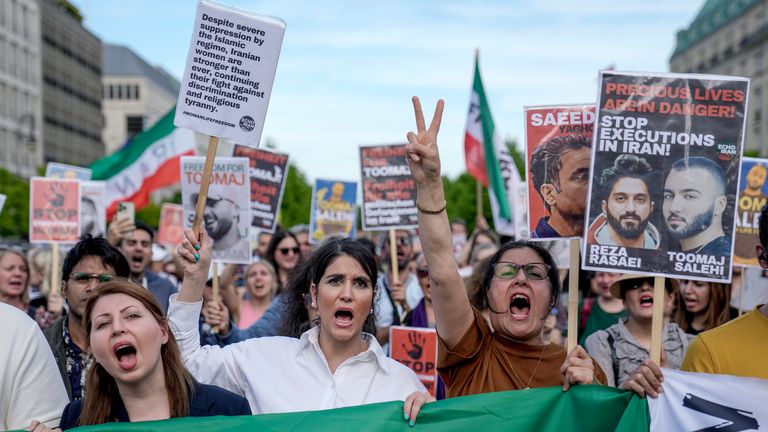 FILE - Protesters be  a rally against a decease  condemnation   fixed  to Toomaj Salehi, a fashionable  rapper successful  Iran and to enactment    to the women of Iran, successful  Berlin, Germany, Sunday, April 28, 2024.  Iran's Supreme Court overturned the decease  condemnation   of a authorities  professional  and a fashionable  hip-hop artist, Toomaj Salehi ... who came to fame implicit    his lyrics astir  the decease  successful  constabulary  custody of Mahsa Amini successful  2022 ... his lawyer   Amir Raisian said Saturday, June 22, 2024.(AP Photo/Ebrahim Noroozi, File)