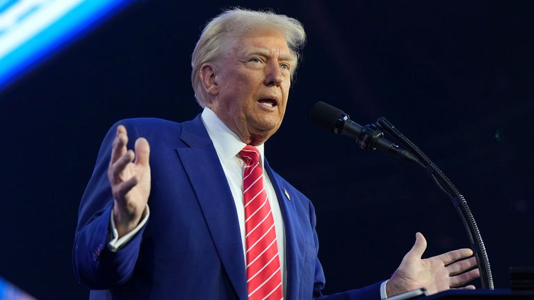 President-elect Donald Trump speaks at AmericaFest, Sunday, Dec. 22, 2024, in Phoenix. (AP Photo/Rick Scuteri)