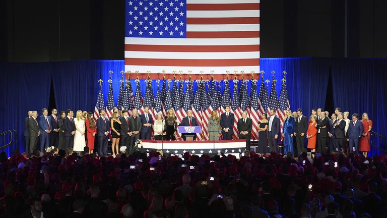 Trump and his sizeable posse on stage. Pic: AP